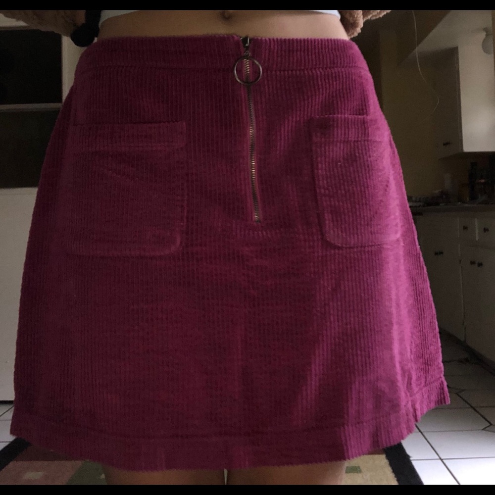 Cute purple skirt goes to mid thigh worn once